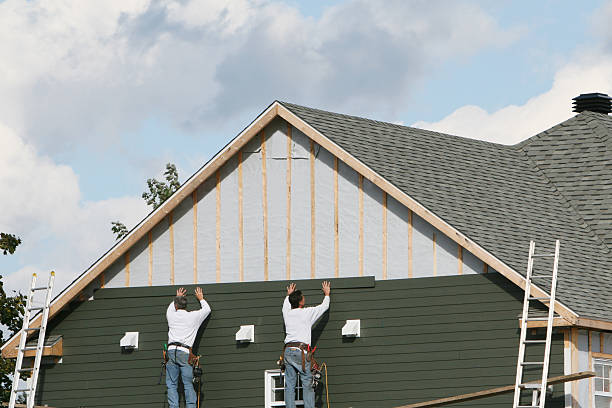 Professional Storm Damage Siding Repair technician working in Kingston, OH